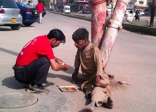 When this shop owner went outside to feed a disabled homeless man.