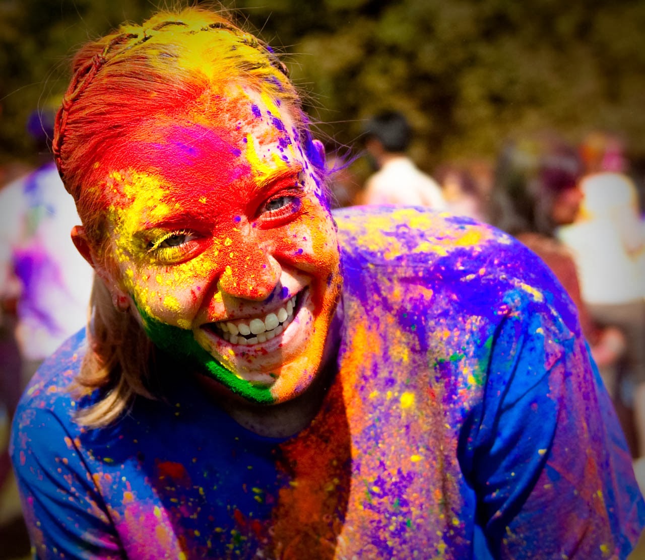 Similing Cute girl Playing Holi 