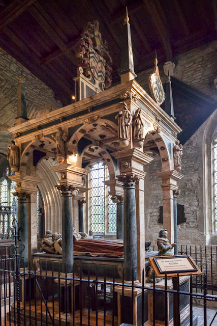 An ornate tomb in the Burford church of St John's in the Cotswolds by Martyn Ferry Photography