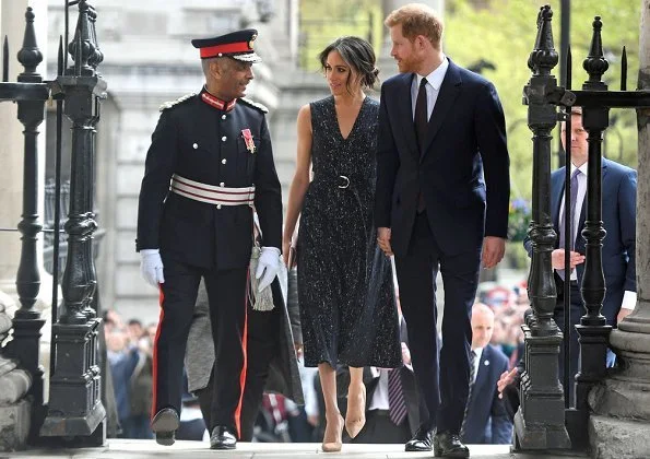 Meghan Markle wore Hugo Boss dress from Spring 2018 Ready-to-Wear Collection. Wilbur and Gussie Bespoke silk Clutch, Manolo Blahnik 'BB' pumps