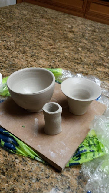 Pieces of a ceramic goblet in progress.