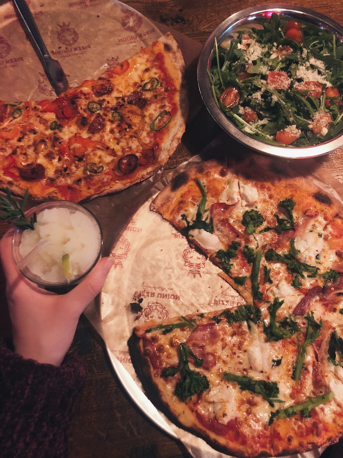 Selection of pizzas and salad
