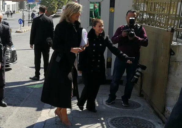 Queen Maxima wore a black wool coat by Natan, and new polka dot dress