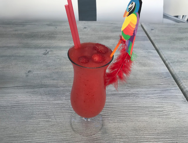handmade cocktail with parrot straw 