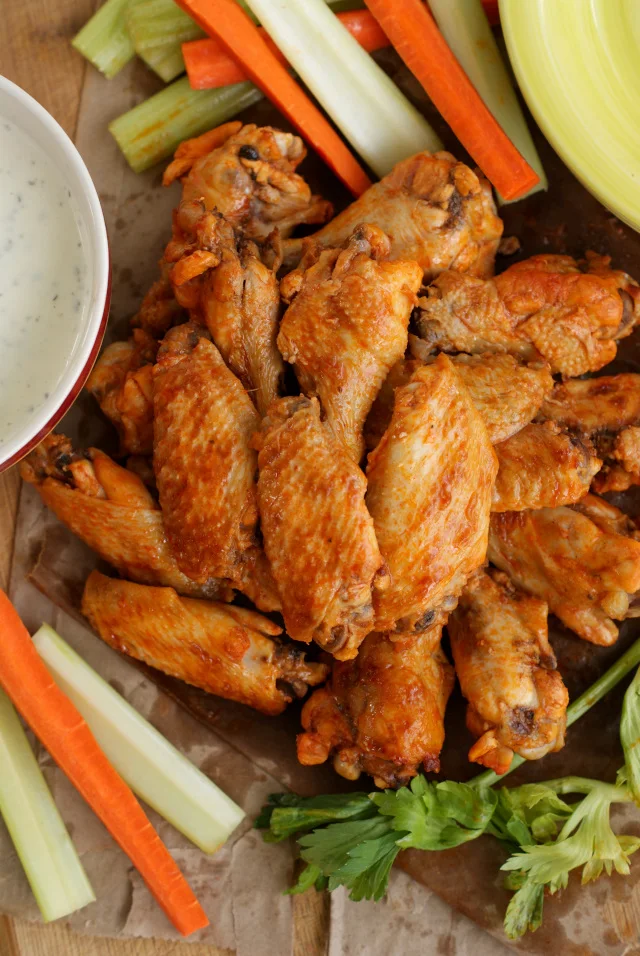 This Crock Pot Chicken Wings recipe is the best way to get bold, spicy, fall-off-the-bone wings.  You will never believe that they are cooked in the crock pot with just three ingredients!