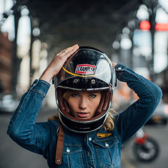 Girl in Ducati Scrambler helmet.