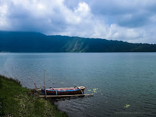 Natural Beauty Of Mountains Lake Beratan And The Canoe At Bedugul, Tabanan, Bali, Indonesia