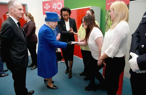 Queen Elizabeth II and Prince Charles, Prince of Wales visit the Prince's Trust Centre in Kennington