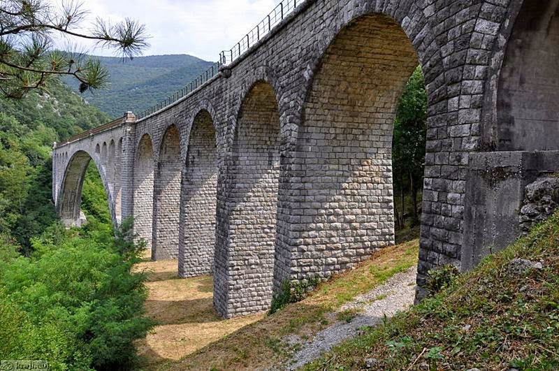 The Solkan Bridge or Ponte di Salcano is a 219.7-meter or 721 ft arch bridge over the Soca River near Nova Gorica in western Slovenia