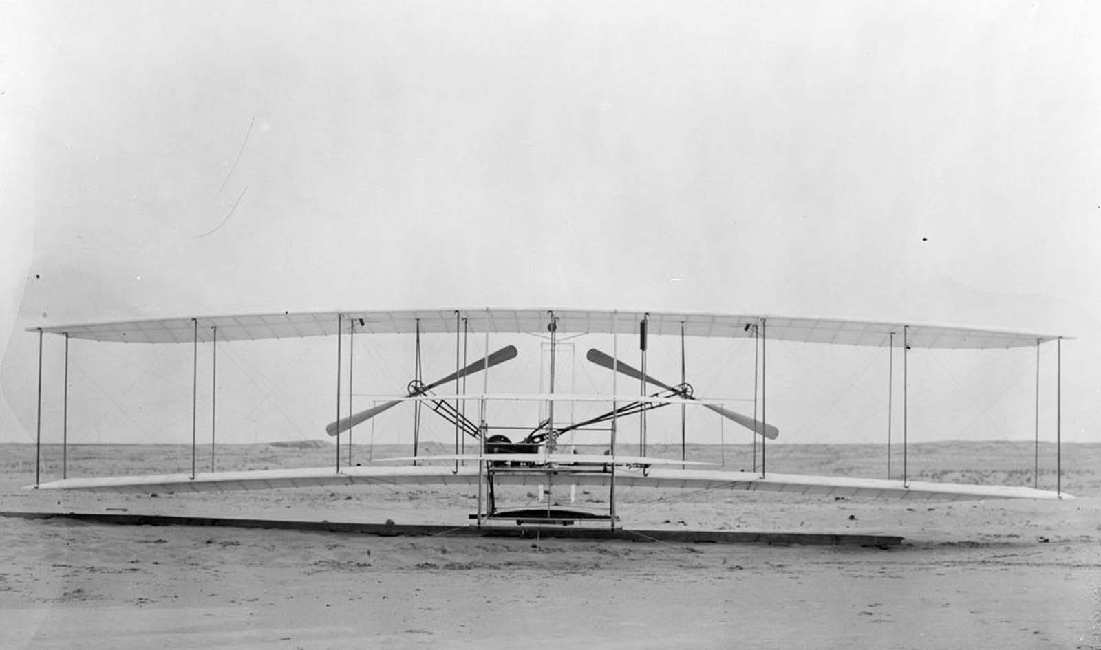 The Wright Flyer I, built in 1903, front view. This machine was the Wright brothers' first powered aircraft. The airplane sported two 8 foot wooden propellers driven by a purpose-built 12 horsepower engine.