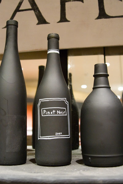 DIY Chalkboard Paint Ideas. I love this idea for spray painting wine bottles and then personalizing them with a faux label or design. These DIY chalkboard paint bottles can be used simply as decorative home accent pieces, vases for your favorite flowers or even as pricing structures for store products.