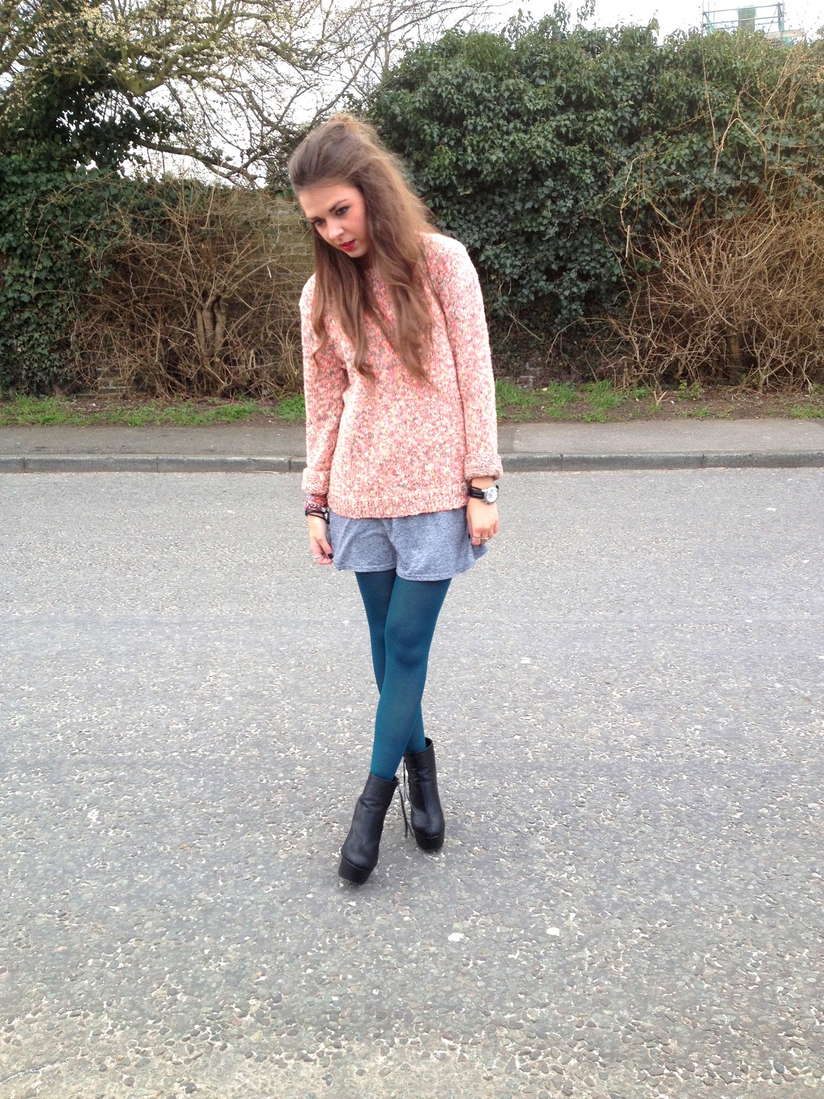SC: Oversized jumper styled with turquoise tights