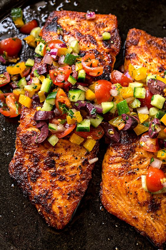 A mildly spicy salmon fillet seared to a succulent, golden-brown perfection, topped with a mediterranean salsa fresca—the perfect pan seared salmon!