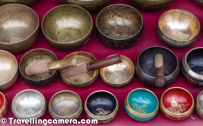 This is again a photograph from Mcleodganj but shot outside the famous temple of His Holiness Dalai Lama. This Photograph shows Singing/Meditation Bowls of different sizes in Mcledoganj Market. These are one of the famous shopping item around Mcledoganj streets and Bhagsu Waterfalls. I have been to Mcledoganj many times but during last visit I got to know about these wonderful pieces of metal which create nice sounds with vibration on rubbing a wooden stick against it's top edge. I have got one and with practice, I am able to get wonderful sounds of of it. 