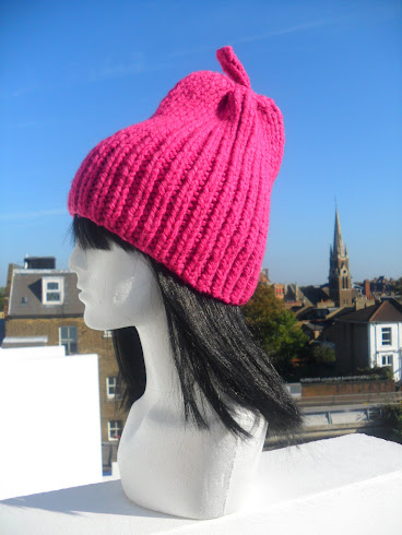 NEW IN .PINK PEAR HAND-KNIT HAT  BY FLORA LYIMO DESIGNER* AVAILABLE IN MANY COLOURS.M:0778 7471024