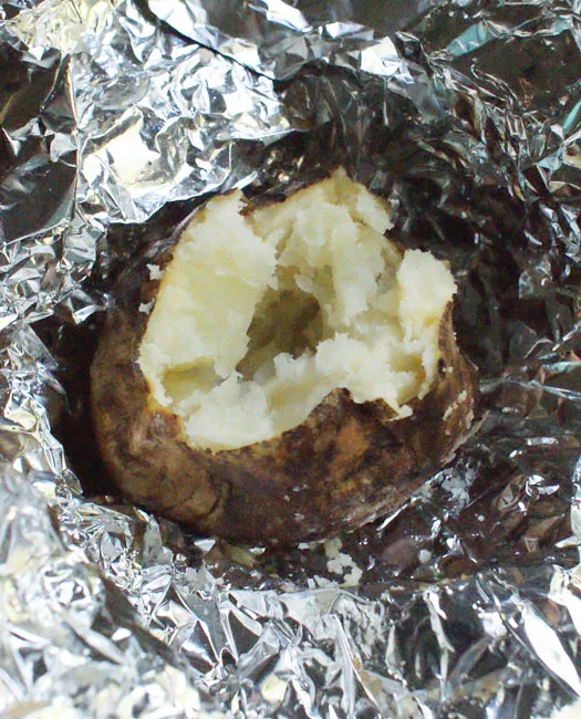 Perfectly fluffy baked potatoes cooked on the grill!