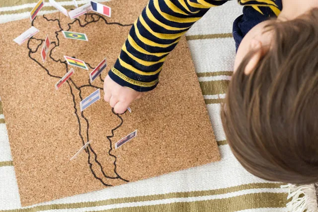 A DIY Montessori flag pin map is a great way to explore both geography and cultures with children. 