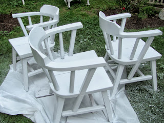 white spray painted chairs outside