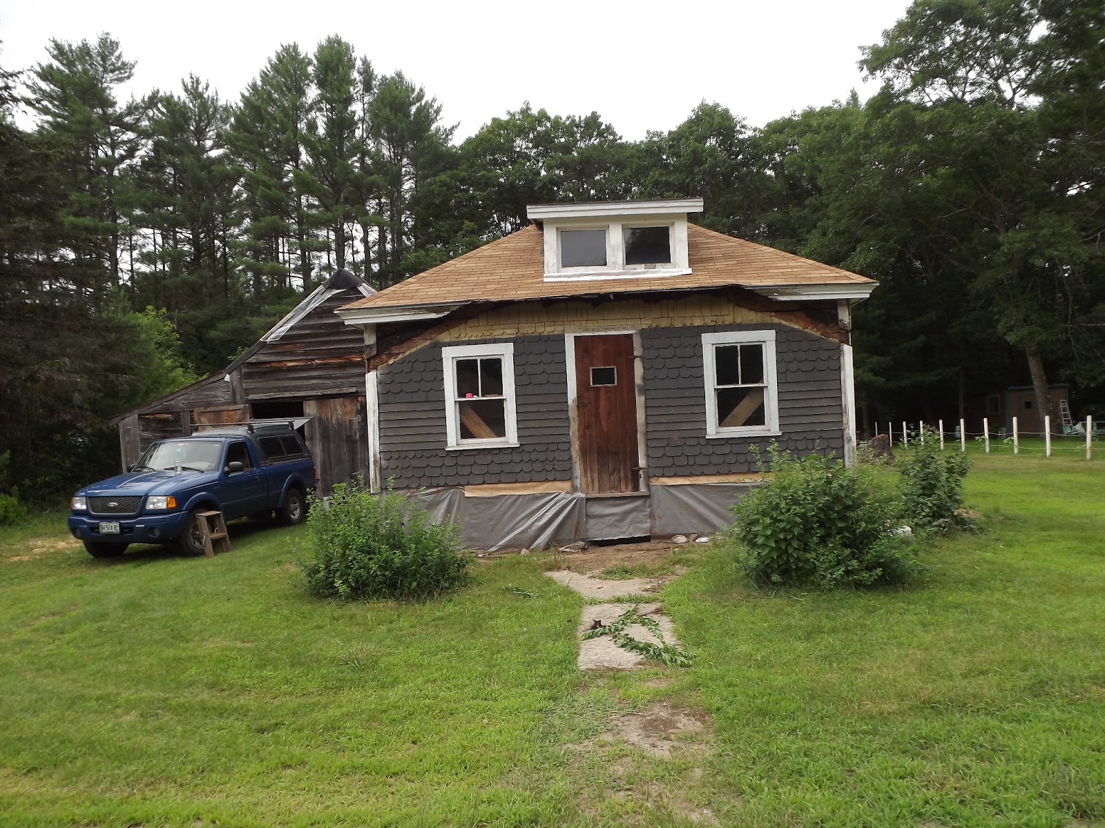 an tigin (the wee house): an update on the outside