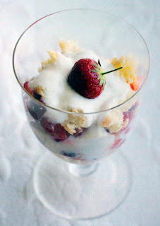 Strawberry Tiramisu: Light dessert of strawberries, fromage frais and sponge fingers served in a dessert glass with a fresh strawberry garnish