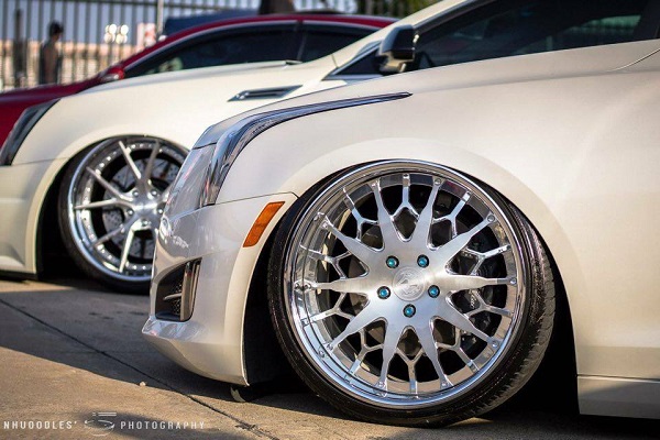 two cadillacs together