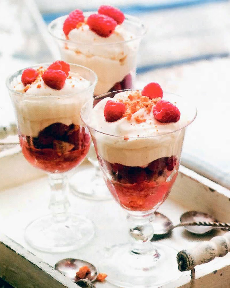 Raspberry Cheesecake in a Glass: Classic individual servings of amaretti biscuits topped with raspberries, mascarpone cheese and cream cheese and finished with raspberries that are simple to make, can be prepared the day before and are great for a dinner party.