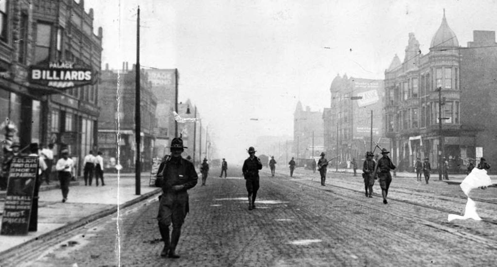 The state run militia patrols the streets of Chicago during the race riot of 1919. Photo dated Aug. 1, 1919.