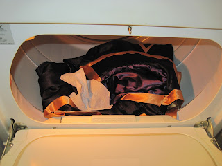 Satin robe in dryer with a woolite dry cleaning sheet