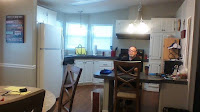 The kitchen and part of the dining area at a rental unit.