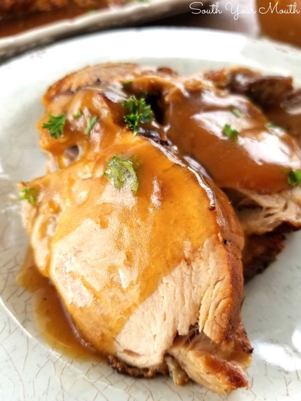 Butter-Braised Slow Cooker Pork Roast | A fork-tender pork loin drenched in sizzling butter seasoned with Cajun spices cooked to crispy perfection in the crock pot.