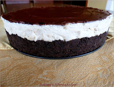 No Bake White Russian Cheesecake, flavors of a White Russian cocktail in a no bake cheesecake filling sandwiched between a chocolate cookie crust and a chocolate glaze | Recipe developed by www.BakingInATornado.com | #recipe #dessert