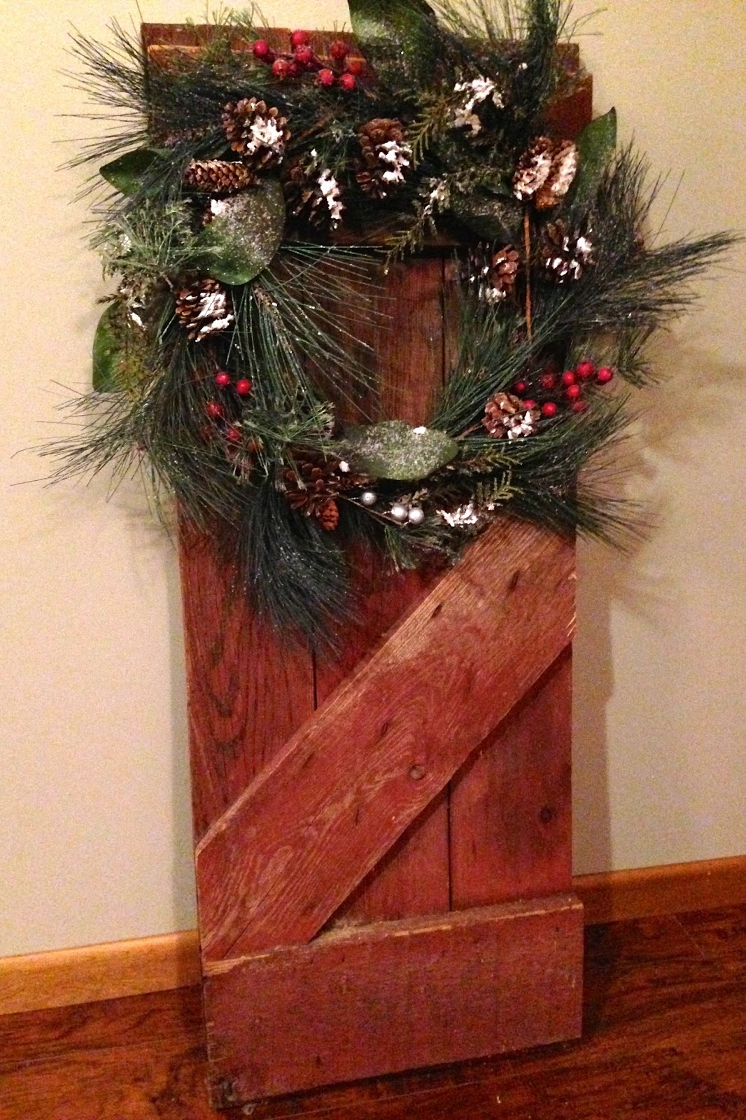 DIY Why Spend More Barn door = great backdrop for wreaths