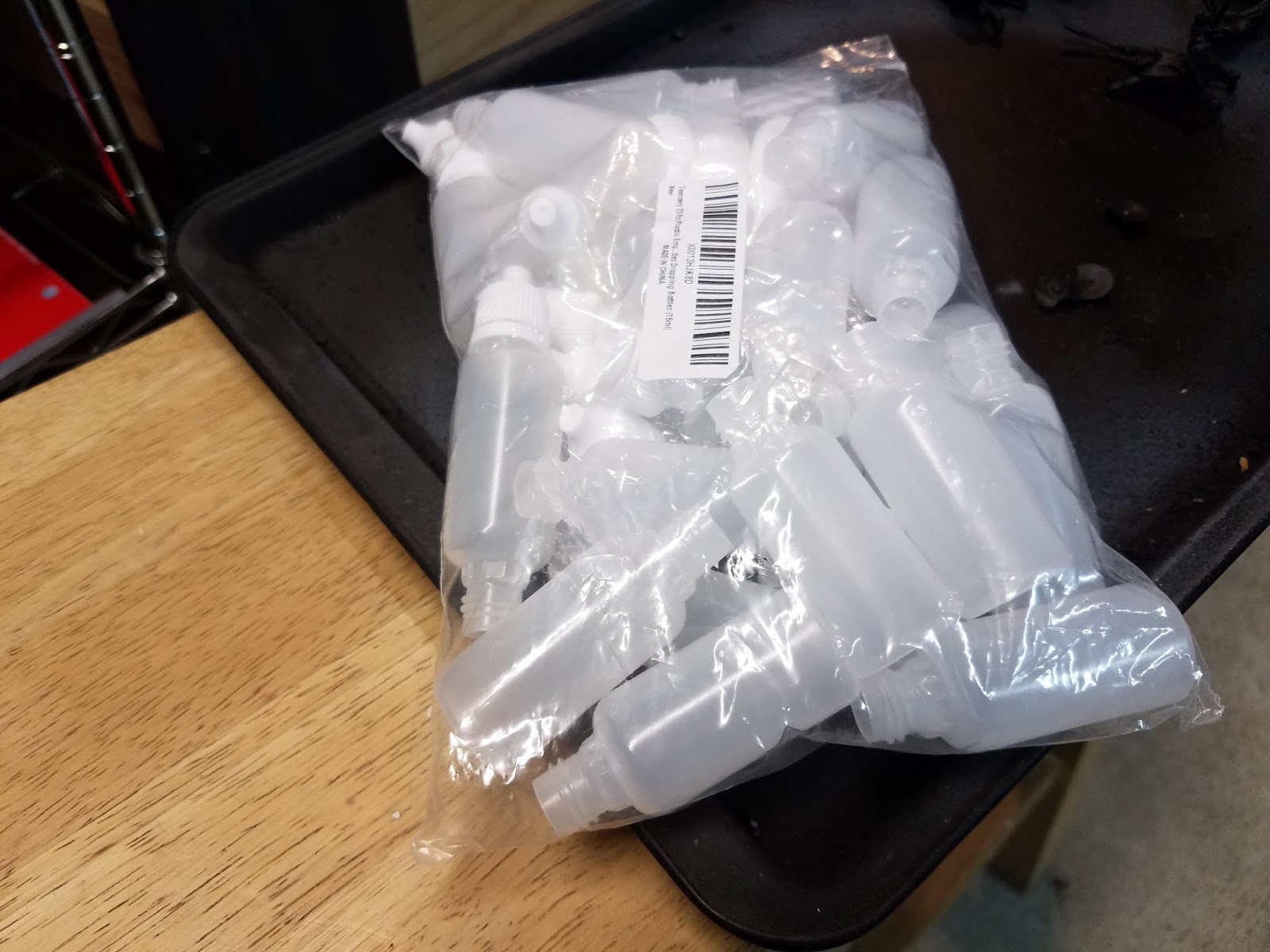 Xin's Lair Citadel Paints and dropper bottles.