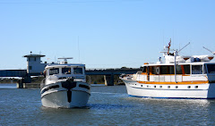 TRUE NORTH and Yacht AMERICA hover at Onslow Bridge.