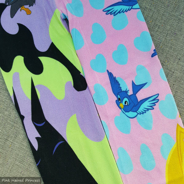 Maleficent flame vs Aurora heart print leg tights tights with purple green flame print on one leg and pink and blue heart print on other