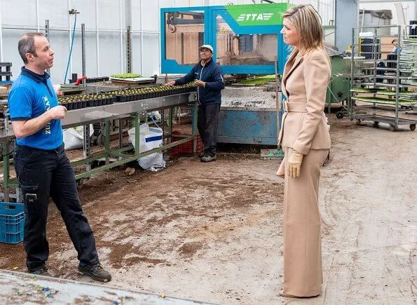 Claes Iversen couture women suits. Queen Maxima wore a camel belted blazer and wide leg trousers by Claes Iversen