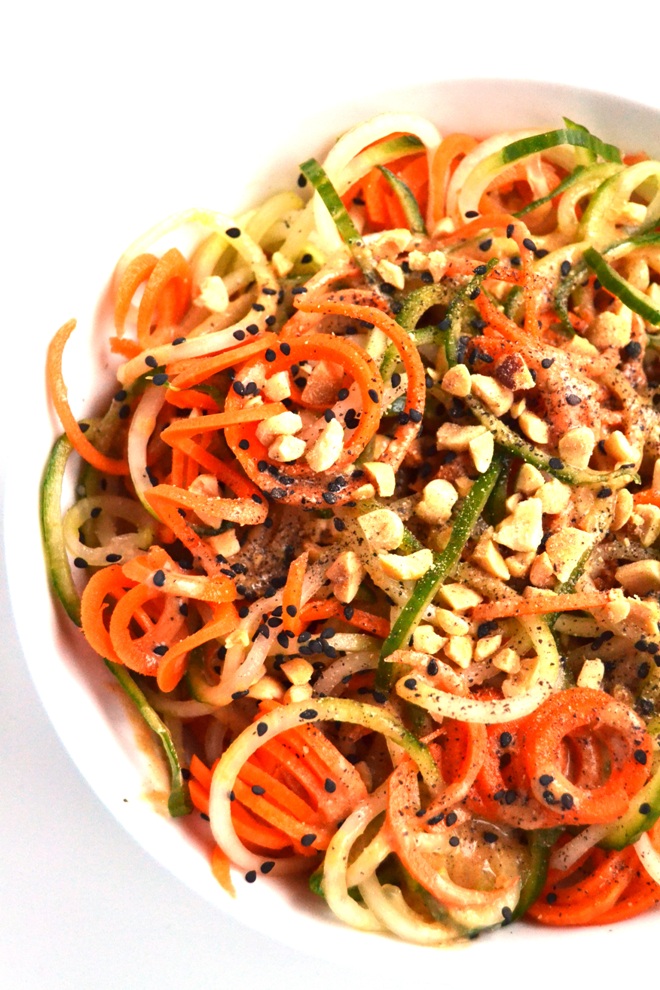 Peanut, Cucumber and Carrot Noodle Salad is ready in just 5 minutes and is the perfect side dish with spiralized vegetables and a tangy peanut sauce topped with sesame seeds and chopped peanuts! www.nutritionistreviews.com