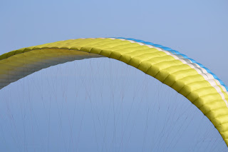 Blue and yellow paragliding