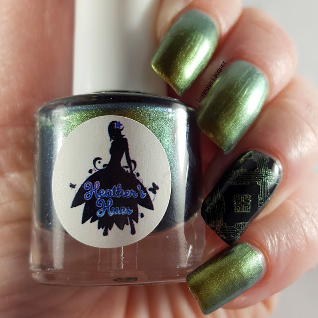 A green to gold shifting multi-chrome polish with flashes of orange