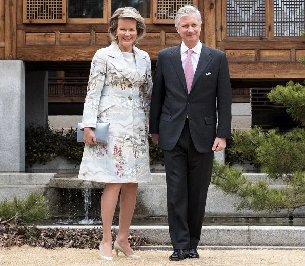 Queen Mathilde wore a green floral print coat by Emporio Armani, and Prive Armani grey satin floral coat, Armani bag and Armani pumps