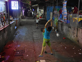 boy misses catching a paper ball in Zhuhai, China