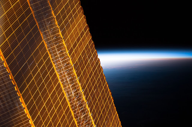Earth and Solar Arrays of the International Space Station