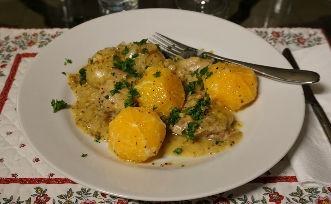 Pork simmered with herbs and clementines
