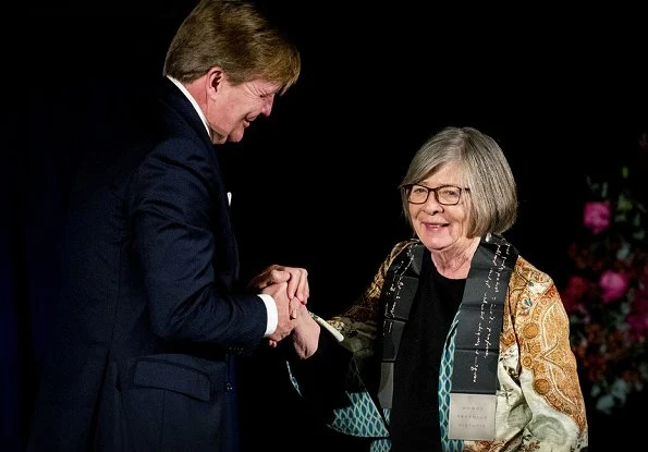 Queen Máxima, Princess Beatrix and Barbara Ehrenreich attended 2018 Erasmus Prize ceremony. Queen Maxima wore Natan red silk ruffled dress