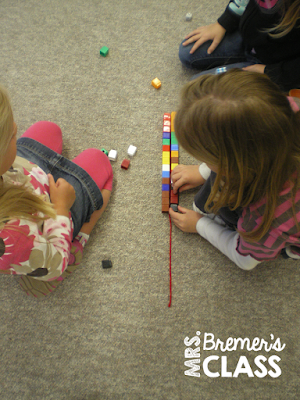 Kindergarten measurement partner activity that includes addition and comparing lengths- just need yarn, dice, and Unifix cubes. See post for how to play!