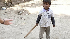 A 3 year old Boy. A broken bat