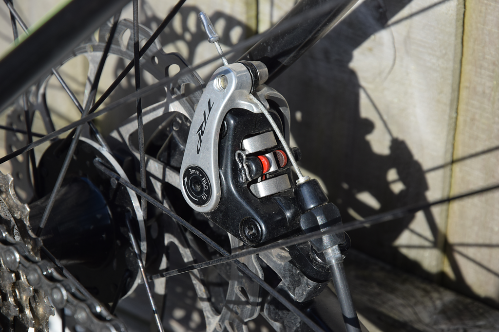 Cycling 200 miles a month Replacing the brake pads in TRP Spyre brakes.