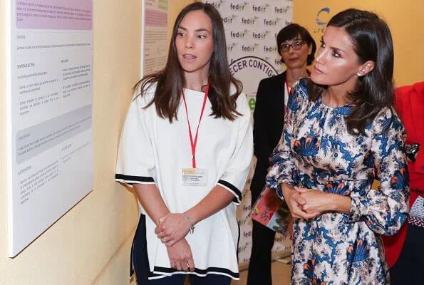 Queen Letizia wore Sandro all-over print long silk dress. Queen Letizia wore Carolina Herrera nude patent leather slingback pumps