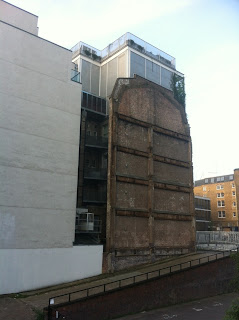 Retaining wall of partly demolished building, Paul Street, London 