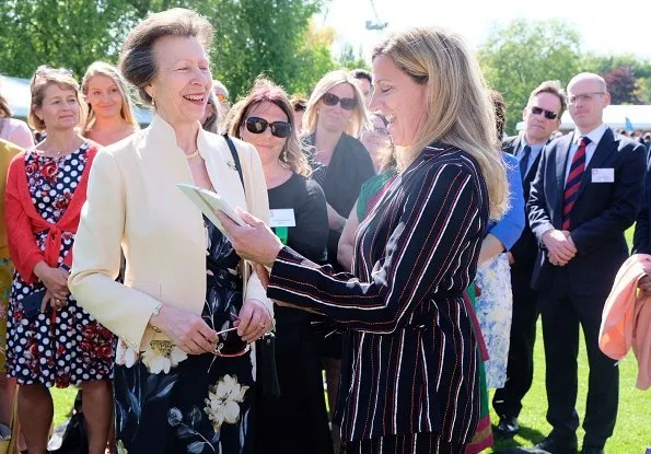 The Princess Royal and Princess Beatrice. Princess Anne wore a floral dress